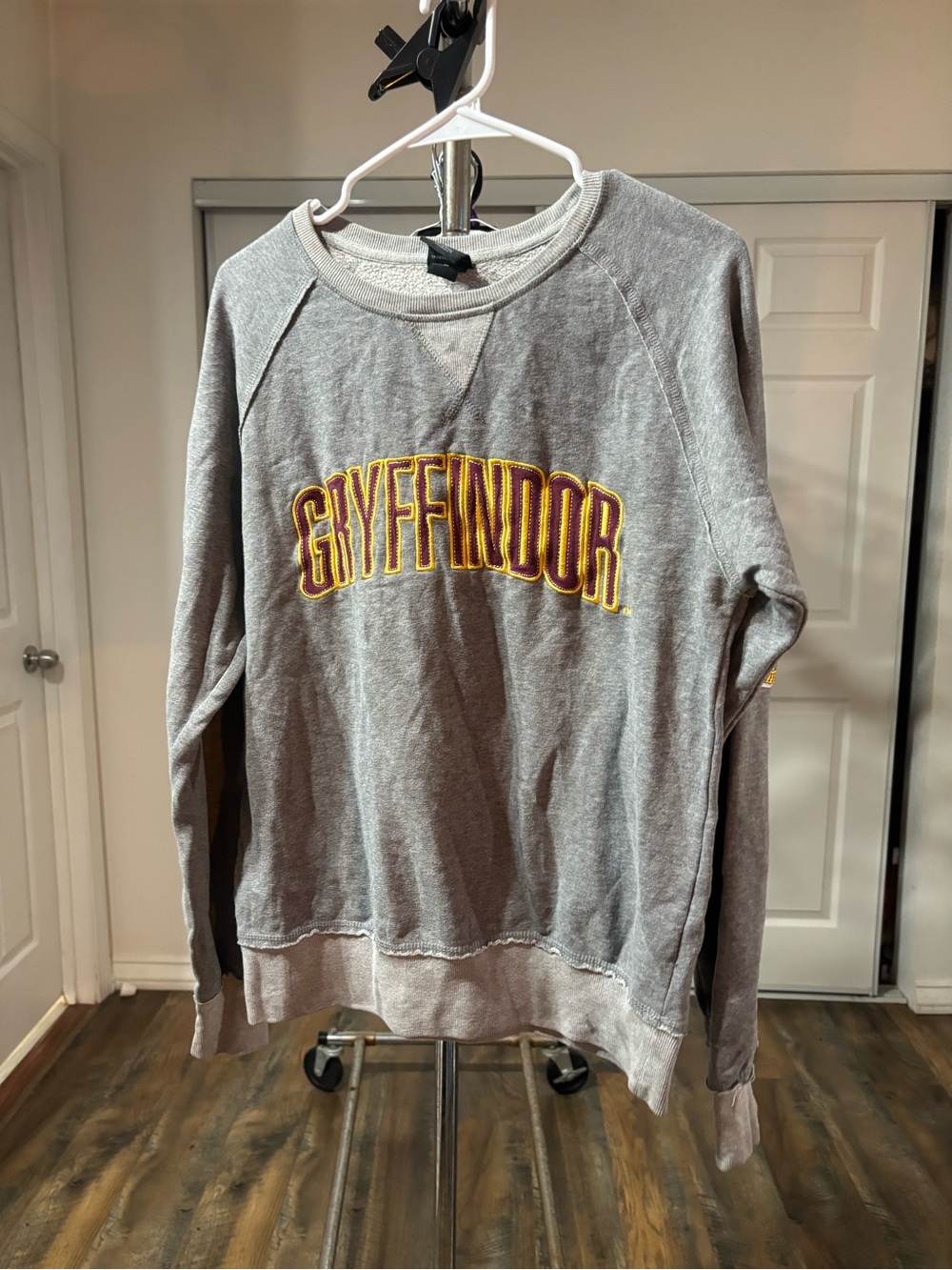 Universal Gray Sweatshirt with Red and Gold Embroidered Detail